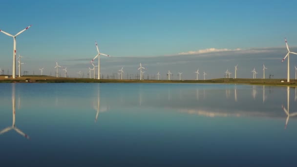 Windmills turbines with water reflection — Stock Video