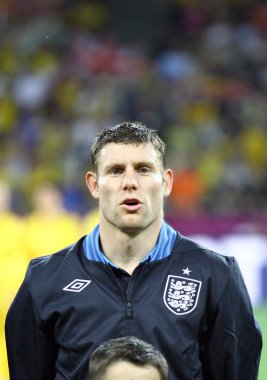 James Milner of England sings the national anthem clipart
