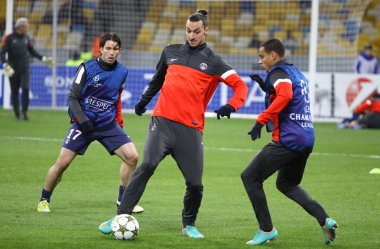 FC Paris Saint-Germain players fight for the ball during trainin clipart