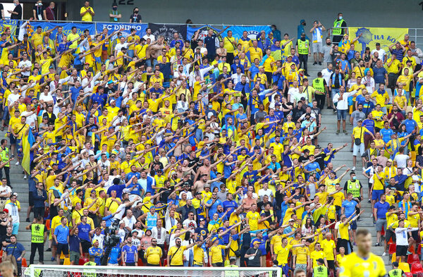 BUCHAREST, ROMANIA - JUNE 21, 2021: Ukrainian fans show their support during the UEFA EURO 2020 game Ukraine - Austria at National Arena Bucharest stadium