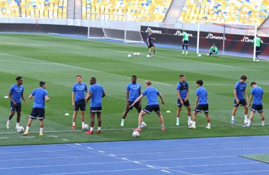 KYIV, UKRAINE - AUGUST 10, 2021: Genk players run during open training session before the UEFA Champions League third qualifying round game against Shakhtar Donetsk in Kyiv