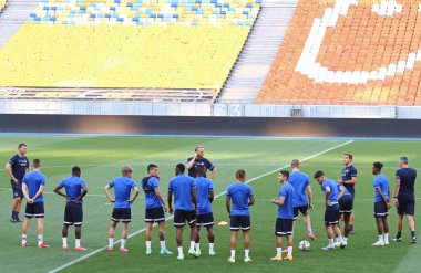 KYIV, UKRAINE - AUGUST 10, 2021: Genk open training session before the UEFA Champions League third qualifying round game against Shakhtar Donetsk in Kyiv. Manager John van den Brom on the background