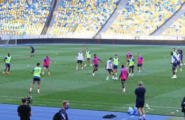 KYIV, UKRAINE - AUGUST 10, 2021: Genk players run during open training session before the UEFA Champions League third qualifying round game against Shakhtar Donetsk in Kyiv