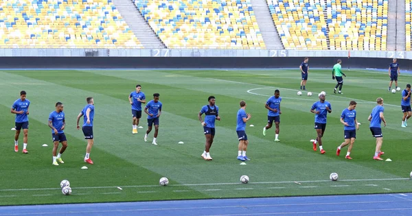KYIV, UKRAINE - AUGUST 10, 2021: Genk players run during open training session before the UEFA Champions League third qualifying round game against Shakhtar Donetsk in Kyiv