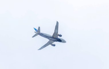 Reykjavik, Iceland - September 5, 2017: Airbus A319-112 (registration number: OY-RCI) operated by Atlantic Airways (FAROELINE) in the sky over Reykjavik city