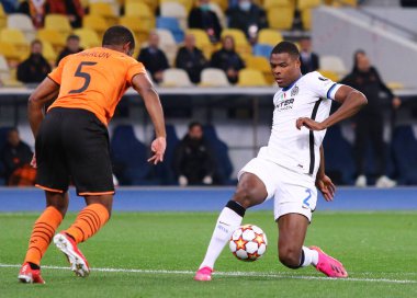 KYIV, UKRAINE - SEPTEMBER 28, 2021: UEFA Champions League game Shakhtar Donetsk v Internazionale. Marlon (Shakhtar) and Denzel Dumfries (Inter). NSC Olimpiyskyi stadium in Kyiv