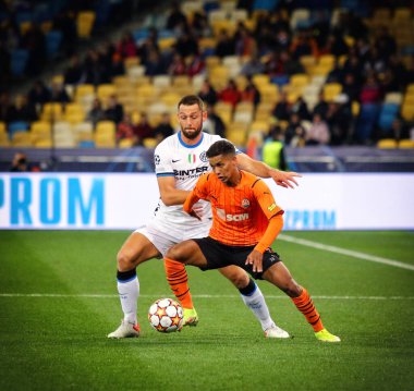 KYIV, UKRAINE - SEPTEMBER 28, 2021: UEFA Champions League game Shakhtar Donetsk v Internazionale. Pedrinho (Shakhtar) and Stefan de Vrij (Inter). NSC Olimpiyskyi stadium in Kyiv