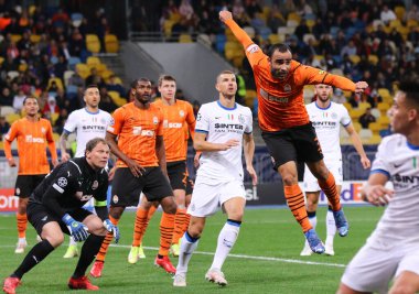 KYIV, UKRAINE - SEPTEMBER 28, 2021: Shakhtar Donetsk (in Orange) and Internazionale (in White) players fight for a ball during their UEFA Champions League game at NSC Olimpiyskyi stadium in Kyiv