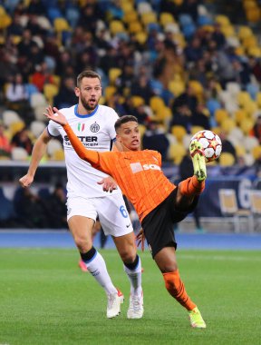 KYIV, UKRAINE - SEPTEMBER 28, 2021: UEFA Champions League game Shakhtar Donetsk v Internazionale. Pedrinho (Shakhtar) and Stefan de Vrij (Inter). NSC Olimpiyskyi stadium in Kyiv
