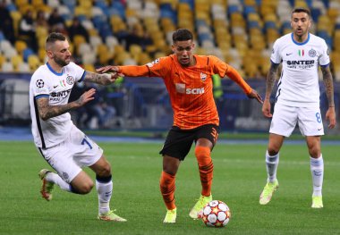 KYIV, UKRAINE - SEPTEMBER 28, 2021: UEFA Champions League game Shakhtar Donetsk v Internazionale. Pedrinho (Shakhtar) and Marcelo Brozovic (Inter). NSC Olimpiyskyi stadium in Kyiv