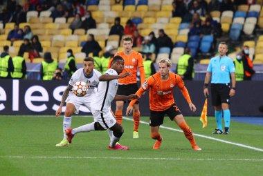 KYIV, UKRAINE - SEPTEMBER 28, 2021: UEFA Champions League game Shakhtar Donetsk v Internazionale. Mykhailo Mudryk (Shakhtar) and Denzel Dumfries (Inter). NSC Olimpiyskyi stadium in Kyiv