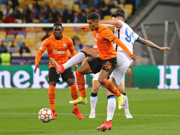 KYIV, UKRAINE - SEPTEMBER 28, 2021: UEFA Champions League game Shakhtar Donetsk v Internazionale. Pedrinho (Shakhtar) and Alessandro Bastoni (Inter). NSC Olimpiyskyi stadium in Kyiv