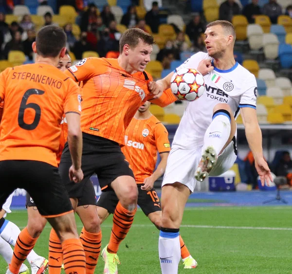 KYIV, UKRAINE - SEPTEMBER 28, 2021: UEFA Champions League game Shakhtar Donetsk v Internazionale. Taras Stepanenko, Mykola Matviyenko (Shakhtar) and Edin Dzeko (Inter). NSC Olimpiyskyi stadium in Kyiv