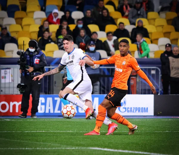 KYIV, UKRAINE - SEPTEMBER 28, 2021: UEFA Champions League game Shakhtar Donetsk v Internazionale. Alessandro Bastoni (Inter) and Tete (Shakhtar). NSC Olimpiyskyi stadium in Kyiv