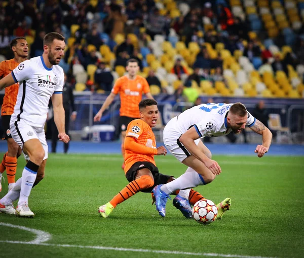 KYIV, UKRAINE - SEPTEMBER 28, 2021: UEFA Champions League game Shakhtar Donetsk v Internazionale. Pedrinho (Shakhtar) and Milan Skriniar (Inter). NSC Olimpiyskyi stadium in Kyiv