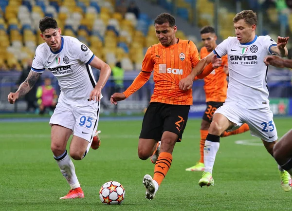 KYIV, UKRAINE - SEPTEMBER 28, 2021: UEFA Champions League game Shakhtar Donetsk v Internazionale. Alan Patrick (C, Shakhtar), Alessandro Bastoni and Nicolo Barella (Inter). NSC Olimpiyskyi stadium