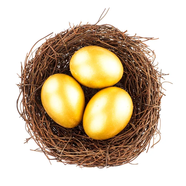 Golden eggs in nest — Stock Photo, Image