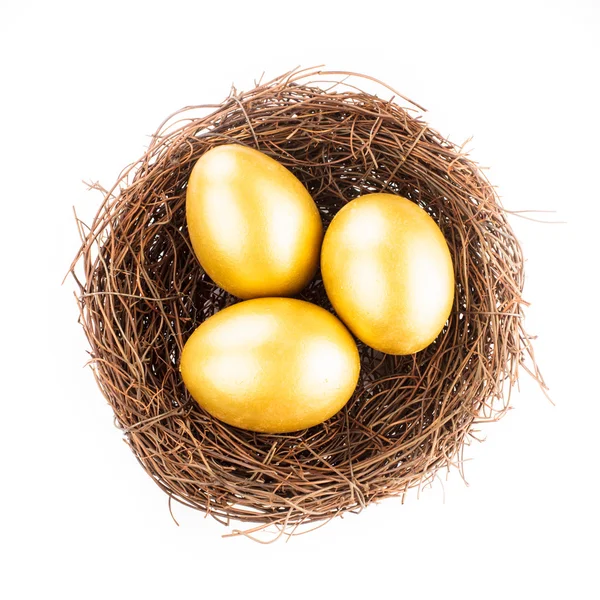 Huevos de oro en nido —  Fotos de Stock