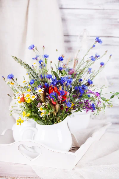 Wildflowers in bottles — Stock Photo, Image