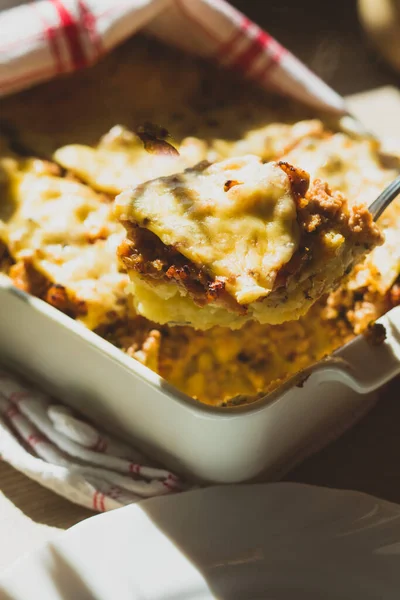 Shepherds pie in white baking dish on the table — Stock Photo, Image