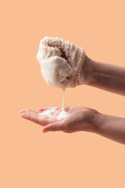 Natural biodegradable washcloth in the female hands — Stock Photo, Image