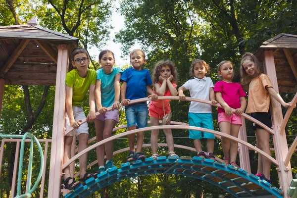The group of friends spend time together in the playground — Stock Photo, Image