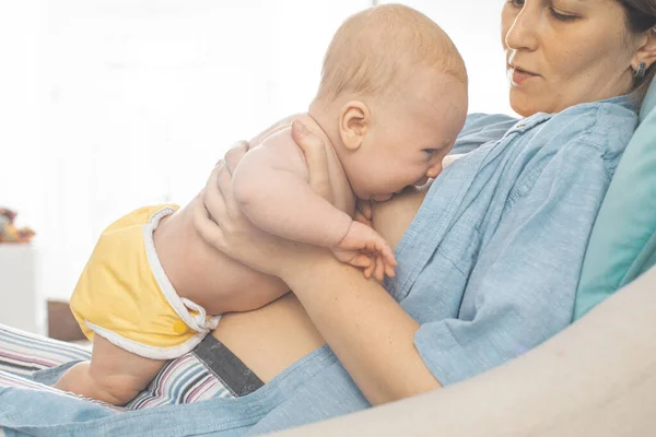 Mothed and baby, breastfeeding in laid back position — Stock Photo, Image