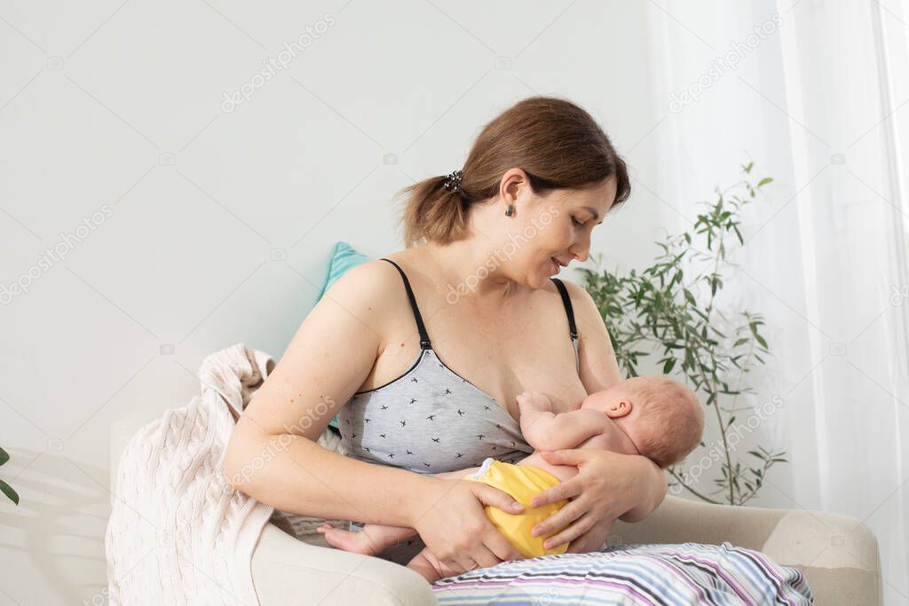 The young mom wants to breastfeed her newborn baby but have breast pain