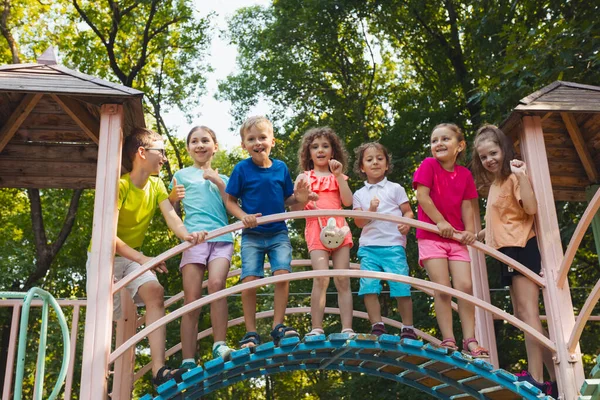 Elementary School Children Stand Bridge Playground Hold Railing Kids Dressed — Stock Photo, Image