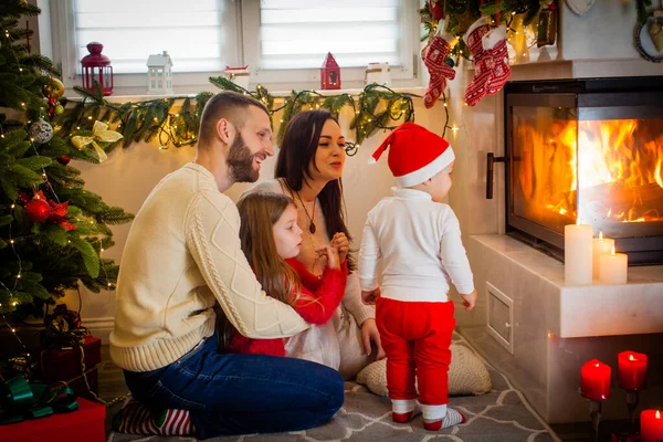 Happy Family Parents Children Sitting Fireplace Christmas Eve — Stock Fotó