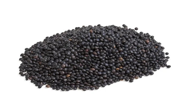 Heap of black lentil isolated on white — Stock Photo, Image