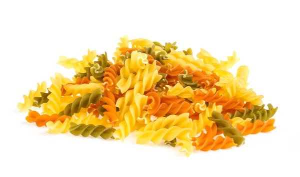 Uncooked pasta fusilli in different colours, white background — Stock Photo, Image