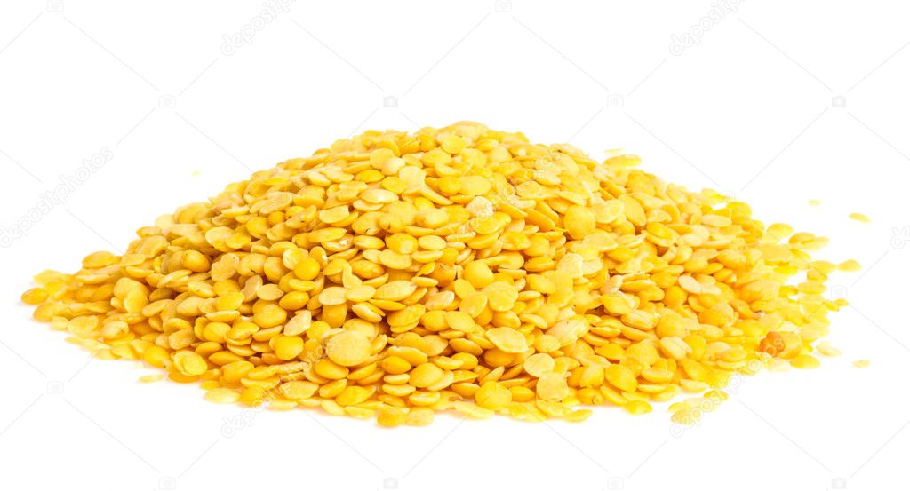 Yellow lentils isolated on white background. Macro shot