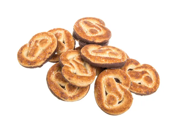 Alça de deliciosos biscoitos isolados no fundo branco — Fotografia de Stock