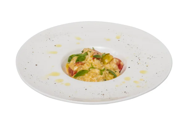 Foto de delicioso plato de risotto con hierbas y tomate en blanco b —  Fotos de Stock