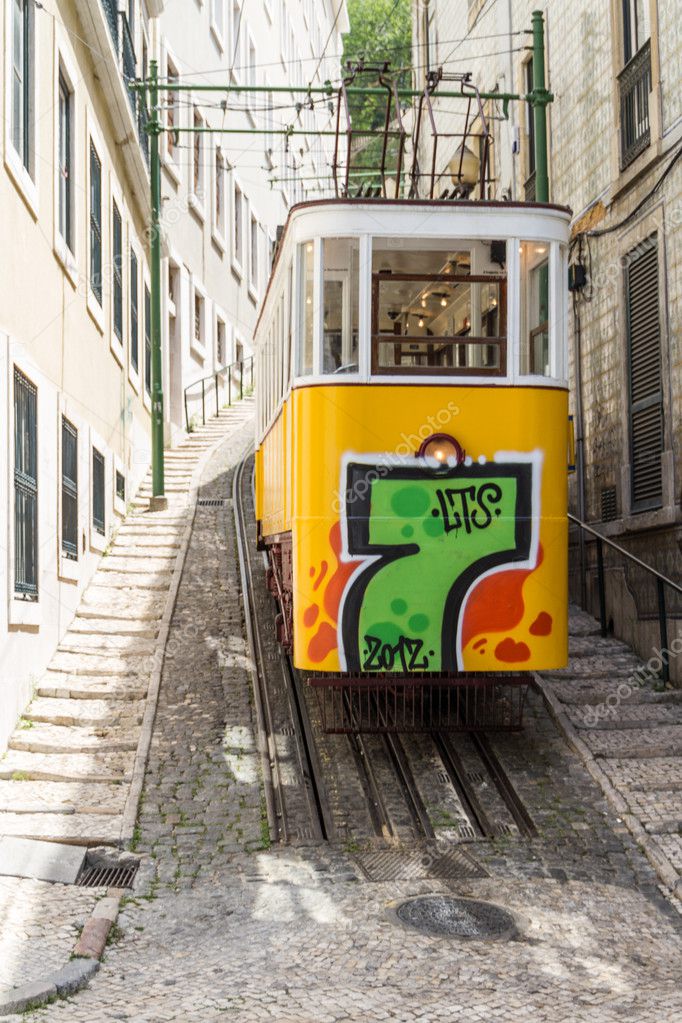 LISBON, PORTUGAL - Jun 25: Traditional yellow and red trams down