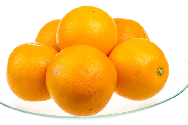 Alça de laranjas no prato — Fotografia de Stock