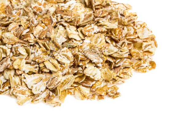 Heap of dry rolled oats isolated on white background — Stock Photo, Image