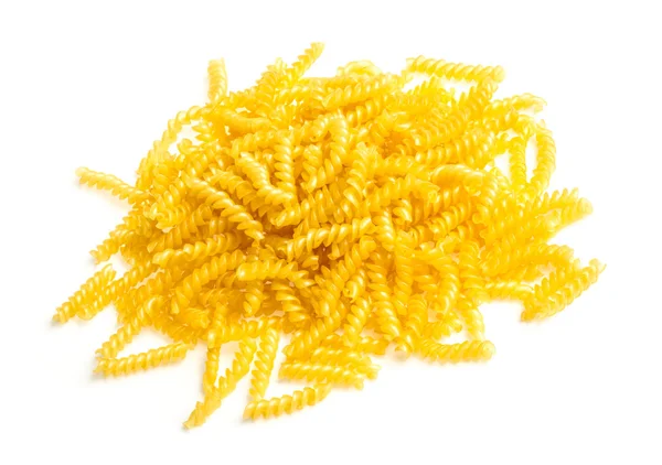 Pile of fusilli pasta close up on wood background — Stock Photo, Image
