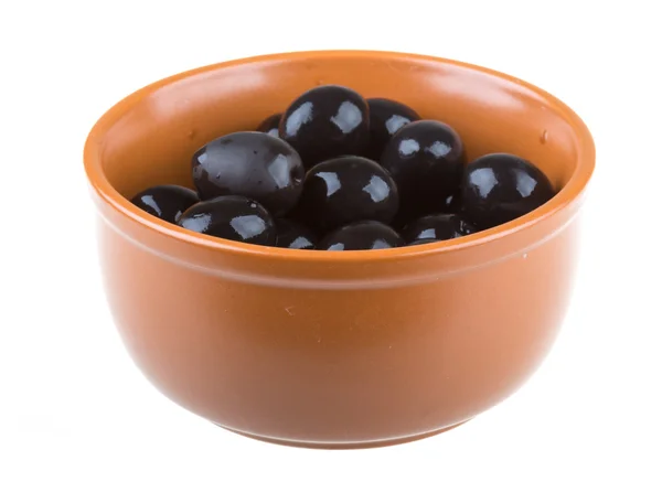 Olives black watered with olive oil in a bowl isolated on a white background — Stock Photo, Image