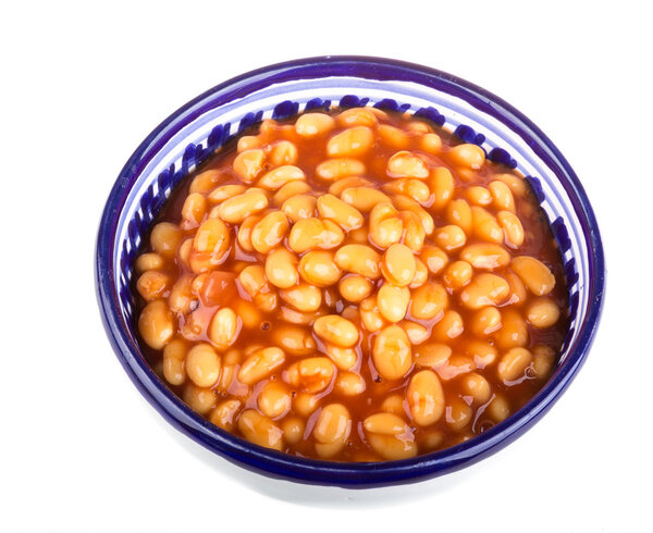 Marinated haricot beans in tomato sauce with shallots on a plate