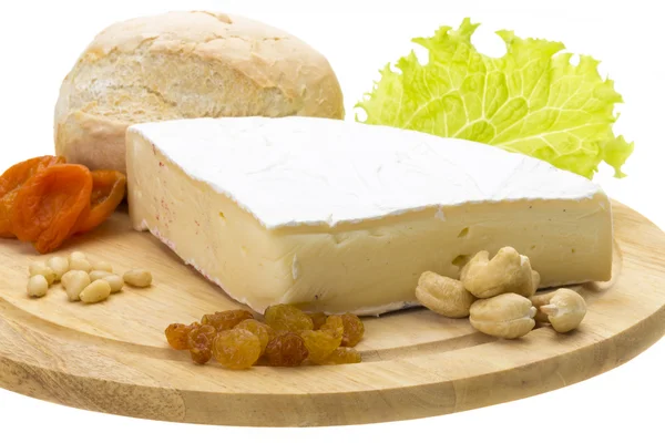 Een stuk brie cheese — Stockfoto