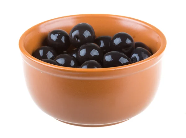 Olives black watered with olive oil in a bowl isolated on a whit — Stock Photo, Image