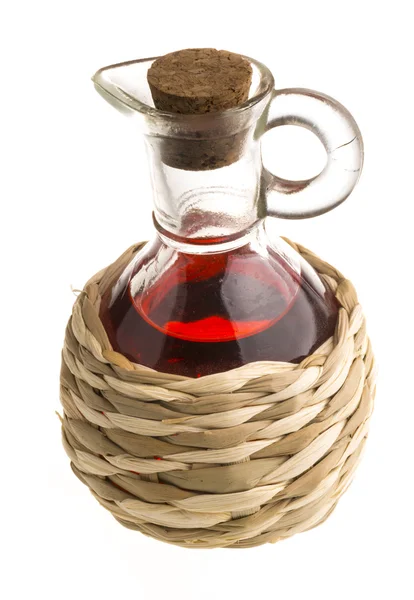 Small decanter with red wine vinegar isolated on the white — Stock Photo, Image