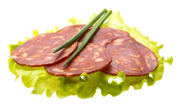 Italian sausages with salad leaves — Stock Photo, Image