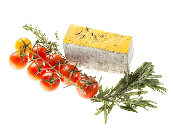 Slice of Roquefort cheese with tomato and herbs — Stock Photo, Image