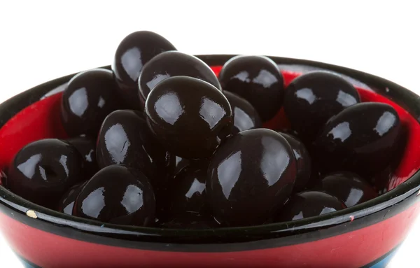 Olives black watered with olive oil in a bowl isolated on a whit — Stock Photo, Image