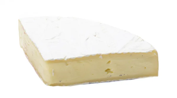 Un pezzo di formaggio brie morbido — Foto Stock