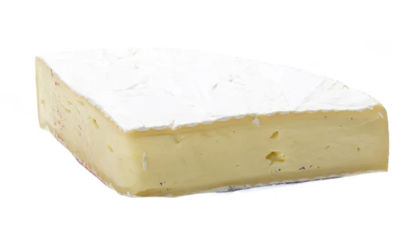 Et stykke blød brie ost - Stock-foto