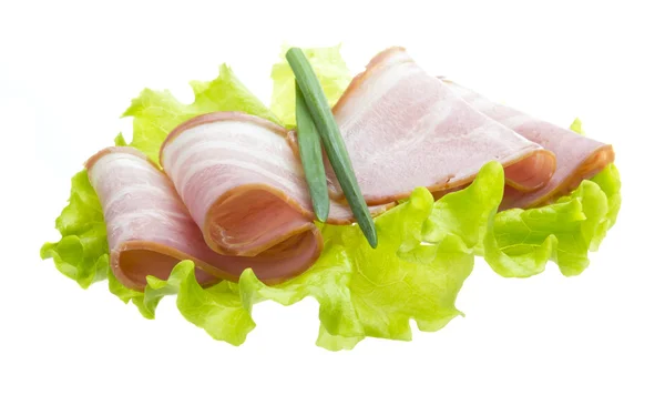 Bacon with salad leaves — Stock Photo, Image